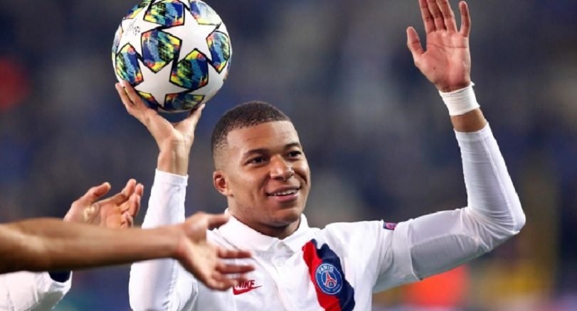 Soccer Football - Champions League - Group A - Club Brugge v Paris St Germain - Jan Breydel Stadium, Bruges, Belgium - October 22, 2019 Paris St Germain's Kylian Mbappe celebrates after the match with the match ball REUTERS/Francois Lenoir