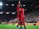 Sadio Mane and Virgil Van Dijk celebrate Liverpool's 3rd goal.