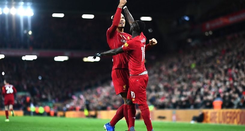 Sadio Mane and Virgil Van Dijk celebrate Liverpool's 3rd goal.