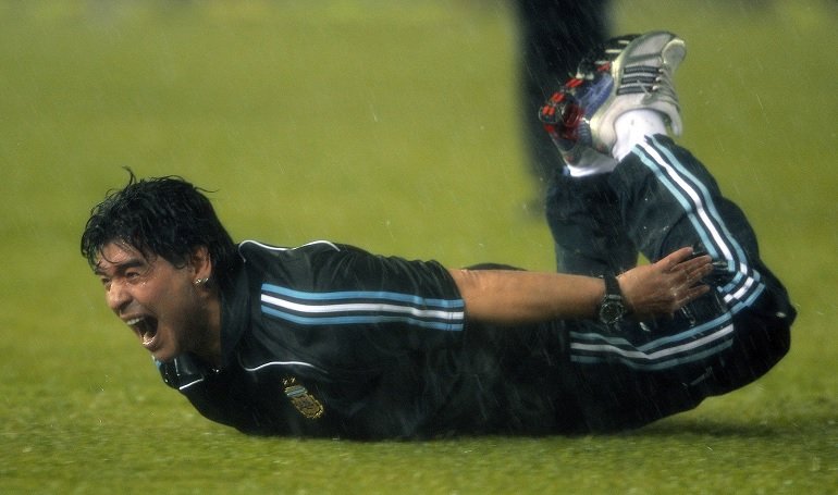 Maradona sliding on the pitch